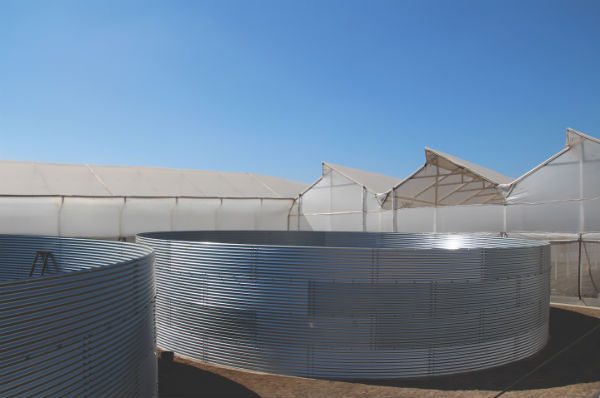 These brand new water silos, each nearly 18,000 cubic feet, replaced older reservoirs and store the farm’s water.