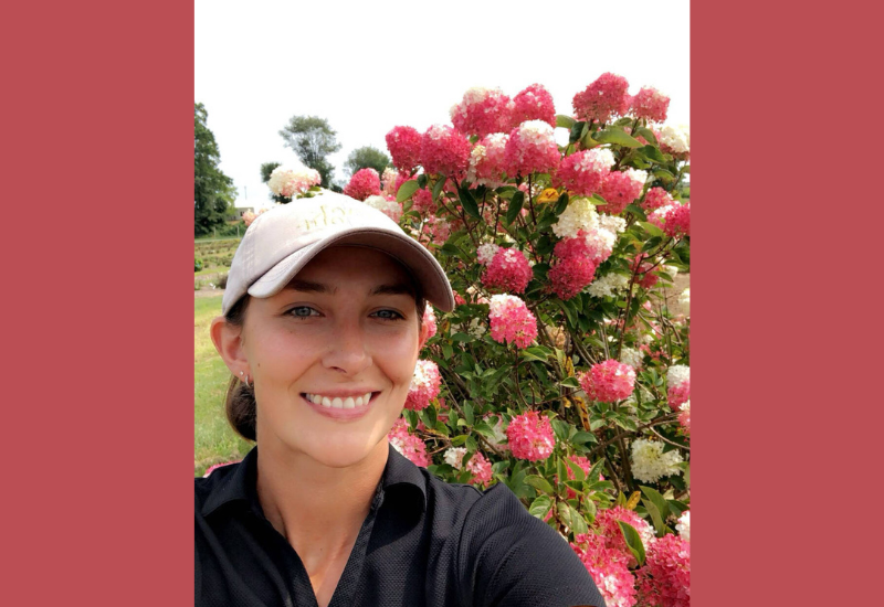 image of GPN's Forty under 40 winner Class of 2025: Mary Woolman with flowers in the background.