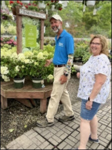 Man and women standing together in a plant nursery