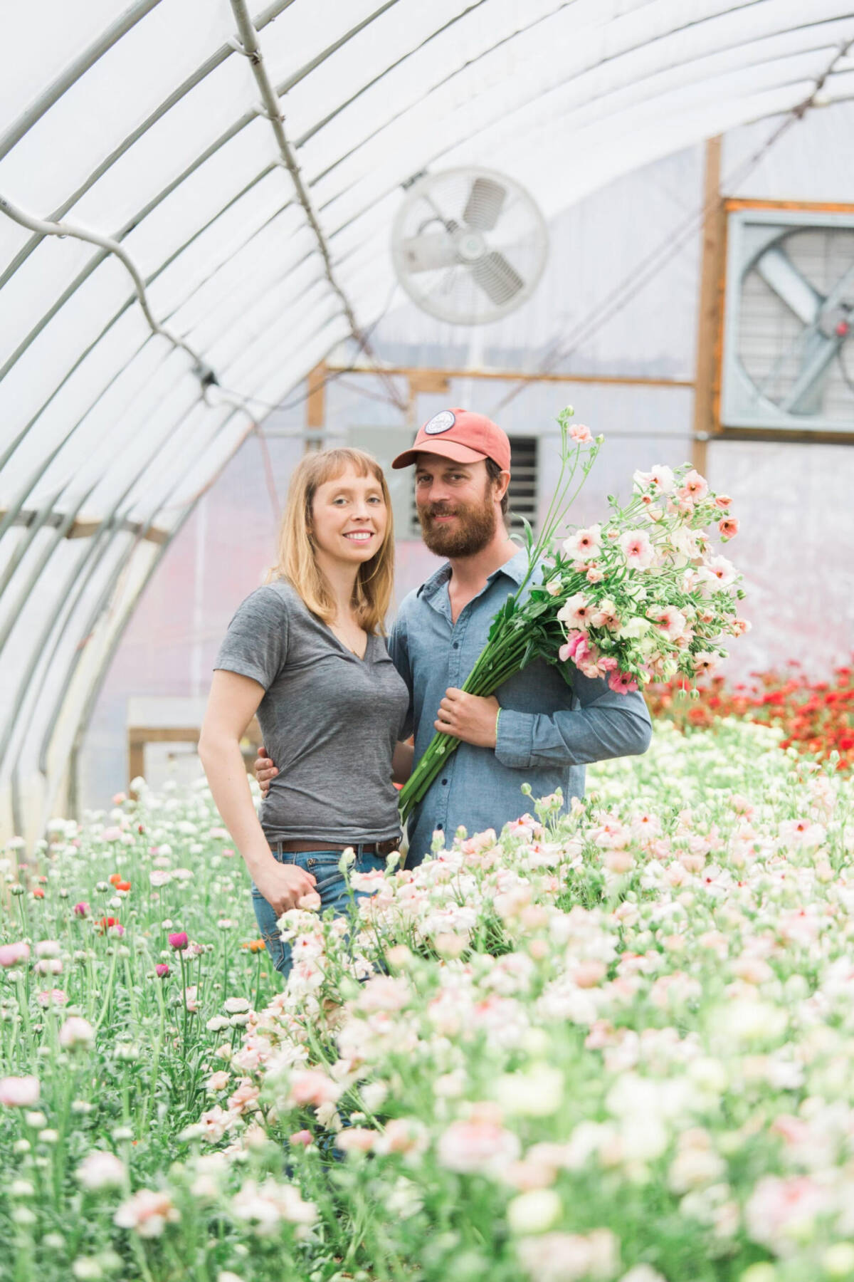 Steve and Gretel Adams, ownersof Sunny Meadows Flower Farm in Ohio, enjoy the blooming lisianthus house. Photo courtesy of Sunny Meadows Flower Farm.