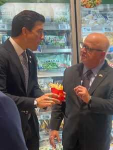 Officials share a container of fries during trade talks in Japan