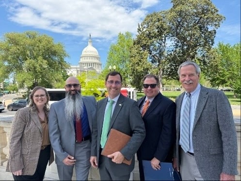A group of people dressed in business clothing