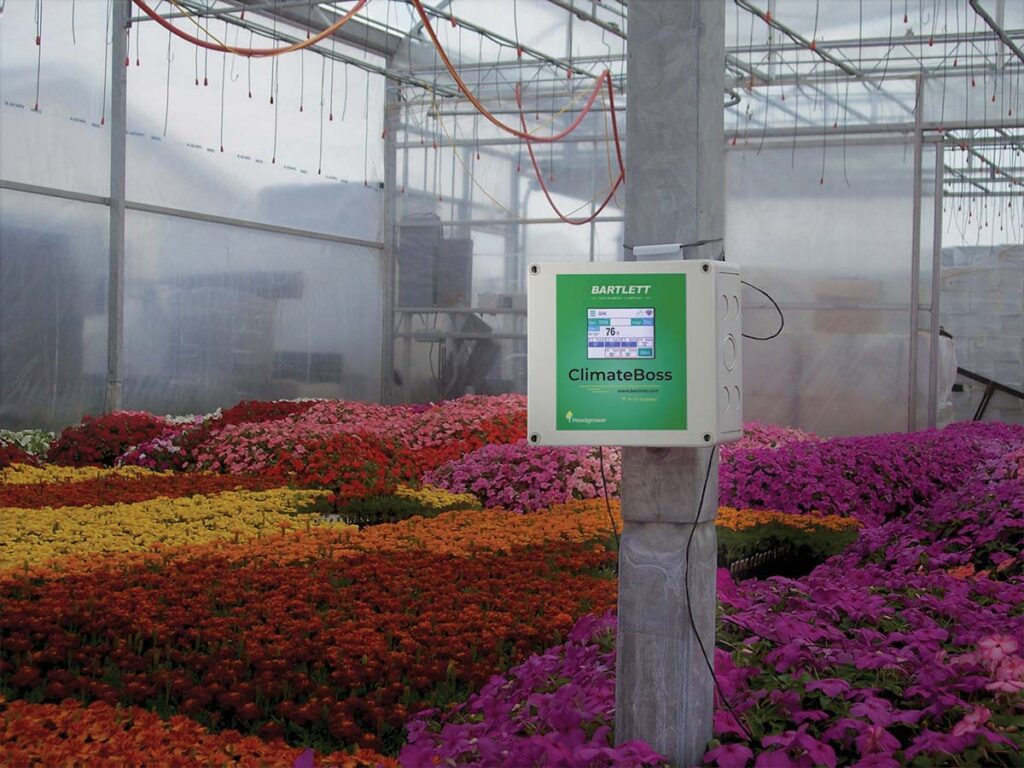 a climate control sensor mounted inside a greenhouse