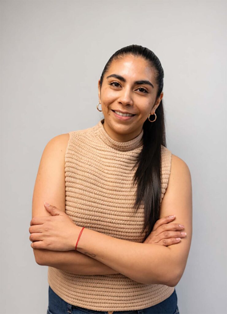 smiling woman with arms crossed