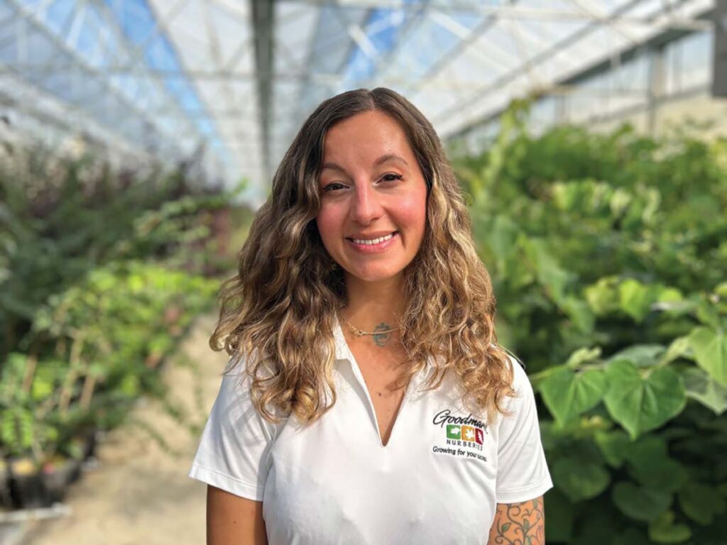 smiling woman in greenhouse