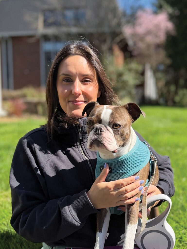 woman holding dog