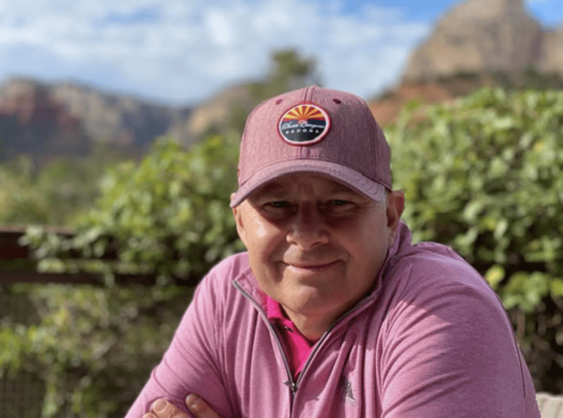smiling man wearing hat